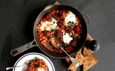 cast iron with meatballs and eggs