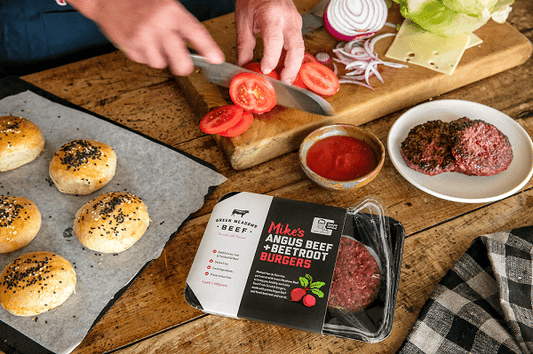 man preparing beef burgers