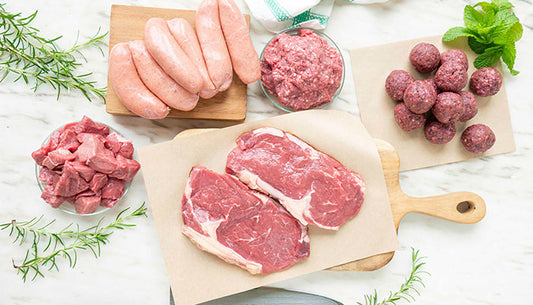 Raw Angus beef cuts on kitchen table