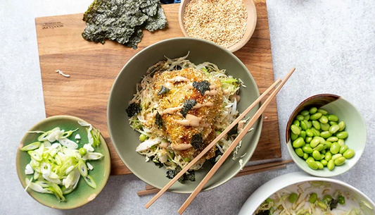 Schnitzel with slaw in a bowl with chopsticks