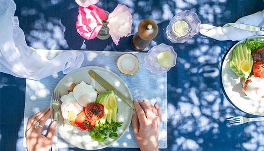 Eggs, tomato, ham and seasonal greens on toast