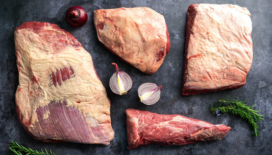 Large beef cuts with sliced onion and herbs