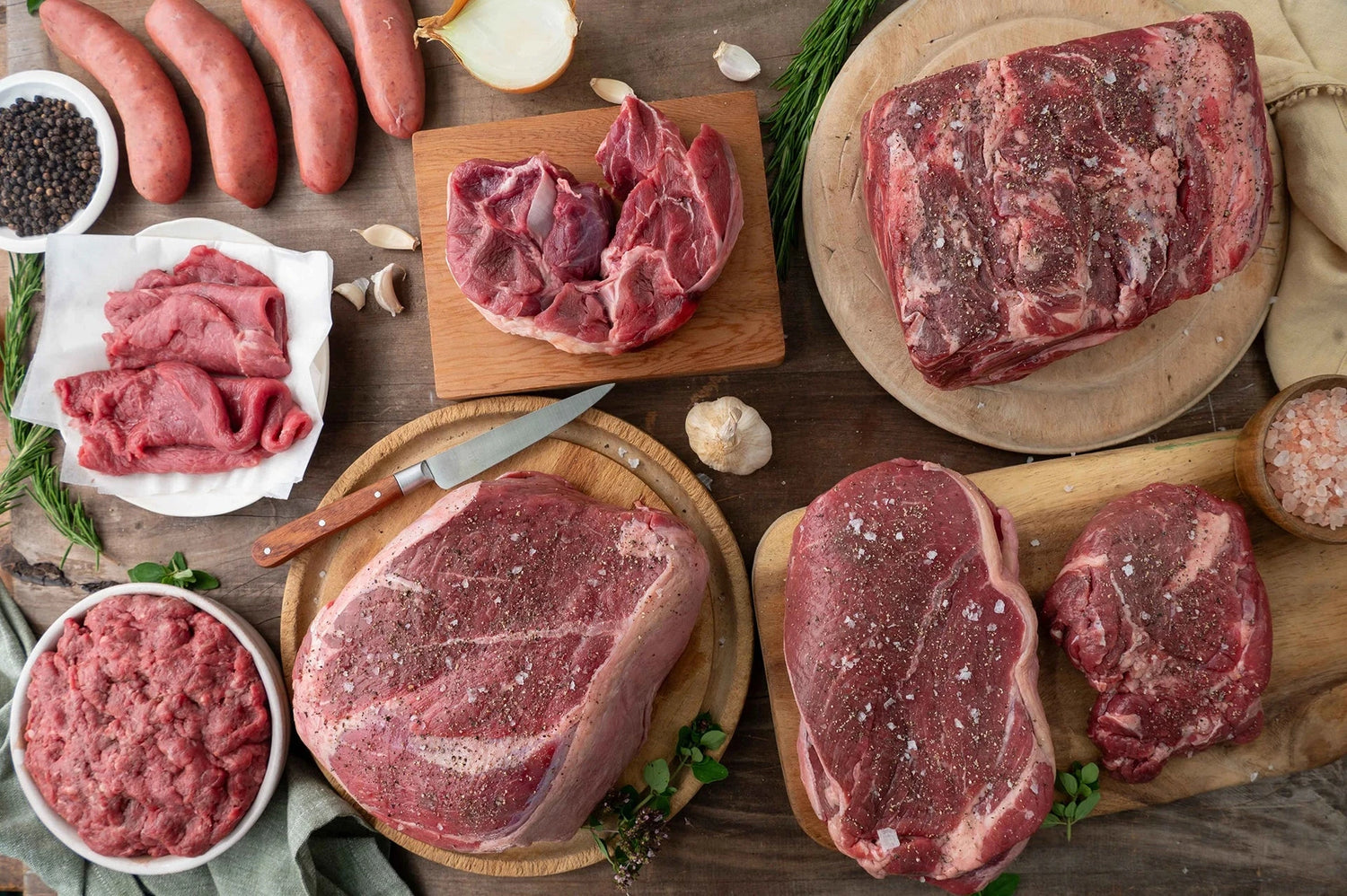 Beef cuts arranged on table 