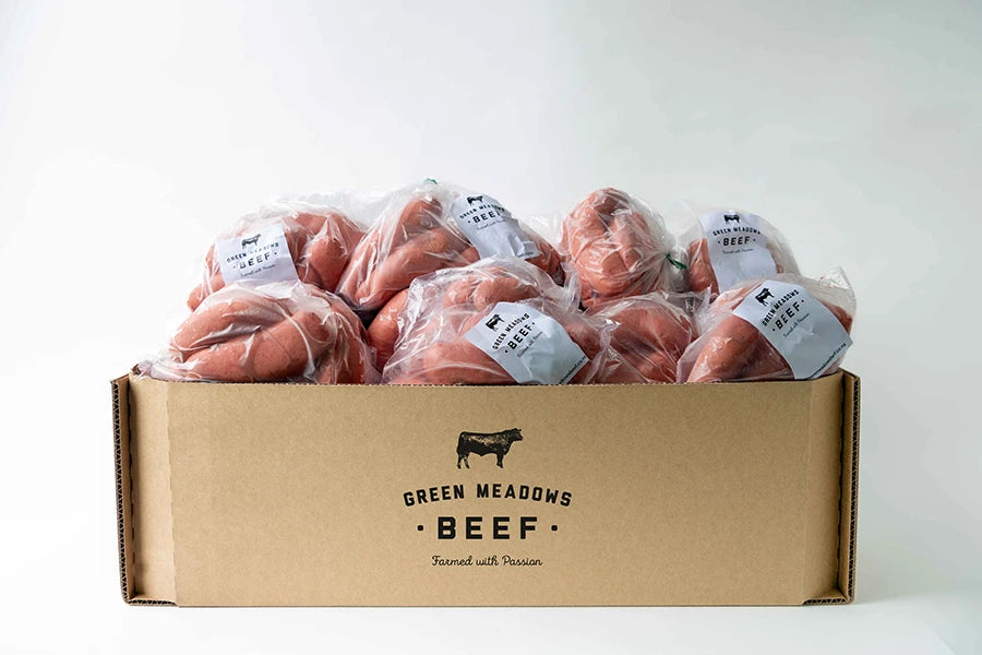 box filled with bags of beef sausages