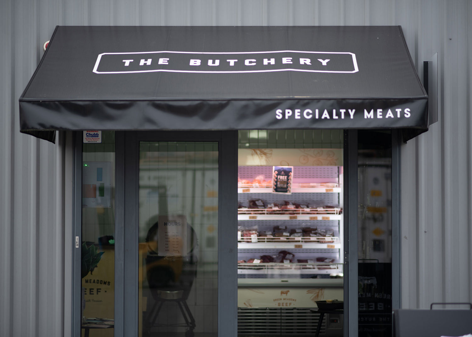 Signage outside Green Meadows Butchery store