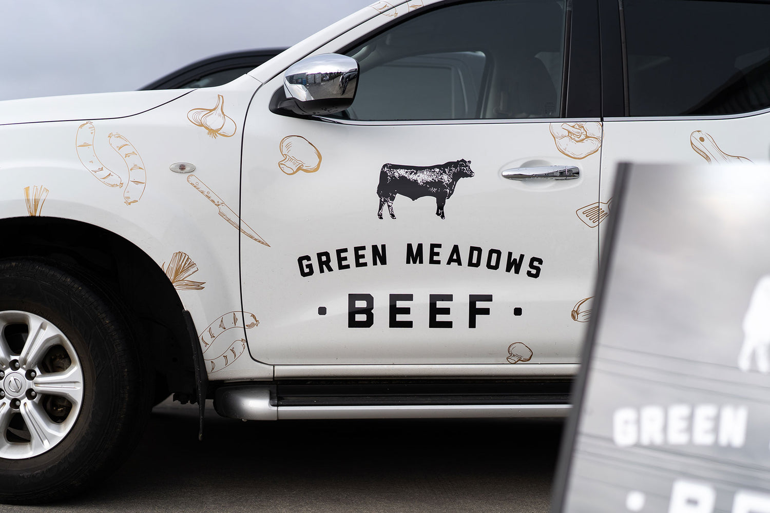 Truck with Green Meadows Beef branding on side