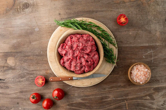 Bowl of mince on wooden kitchen table