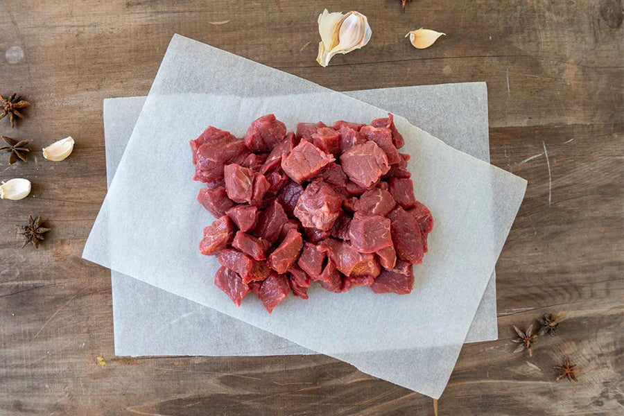 diced beef arranged on baking paper