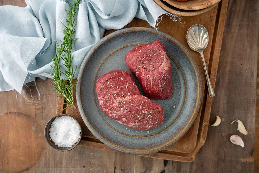 two angus beef eye fillet steaks on a plate