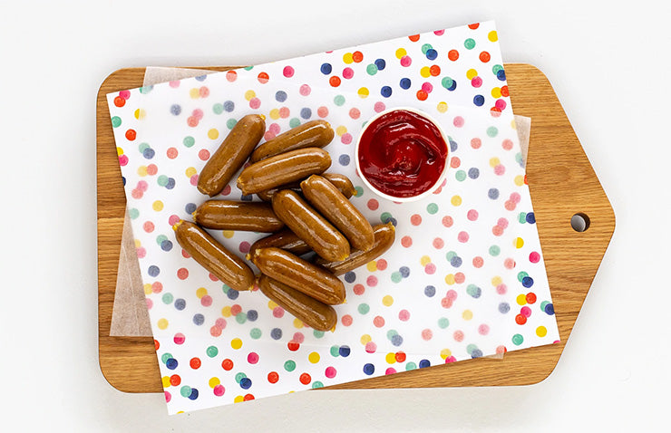 board of junior sausages on polka dot paper