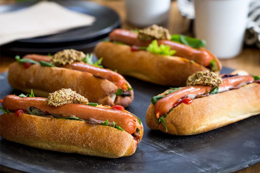 4 gourmet hotdogs with mustard