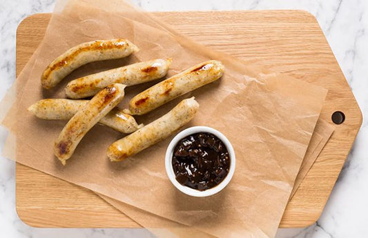 Chicken Sausages on chopping board