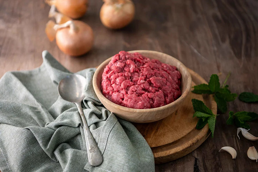 Beef mince in wooden dish