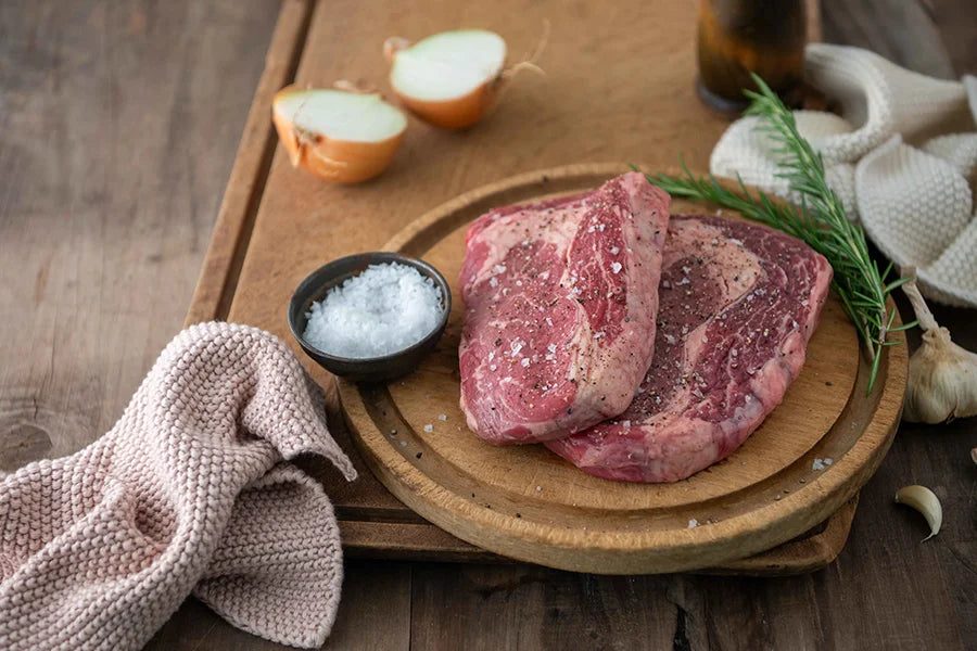 raw sirloin steak with salt seasoning